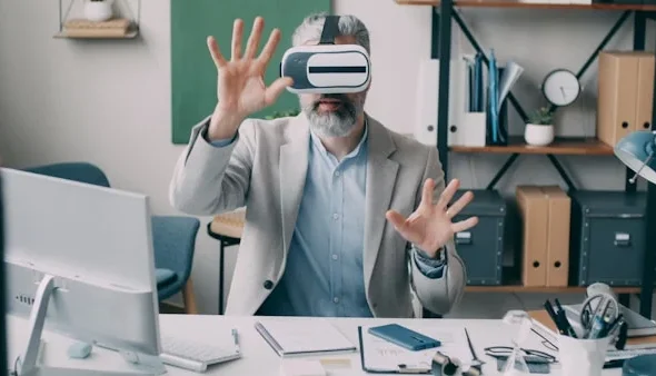 Professional using VR headset in modern office demonstrating spatial computing technology